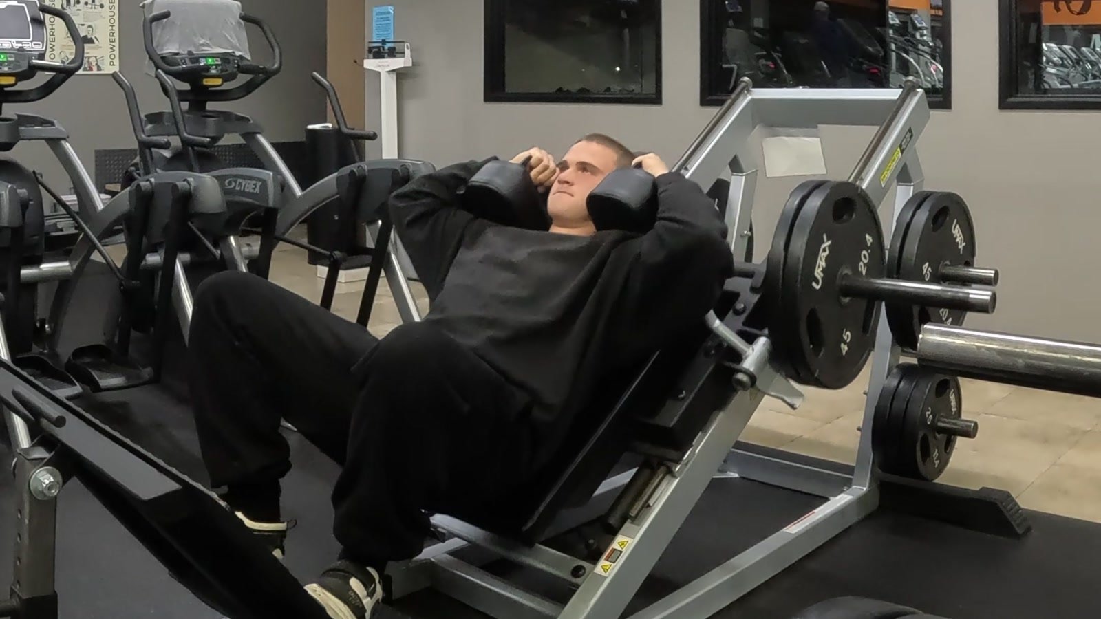 Markus positioned in a hack squat machine.